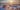 Sunset by the sea at sunset, a blanket is lying on the beach, a