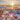 Sunset by the sea at sunset, a blanket is lying on the beach, a